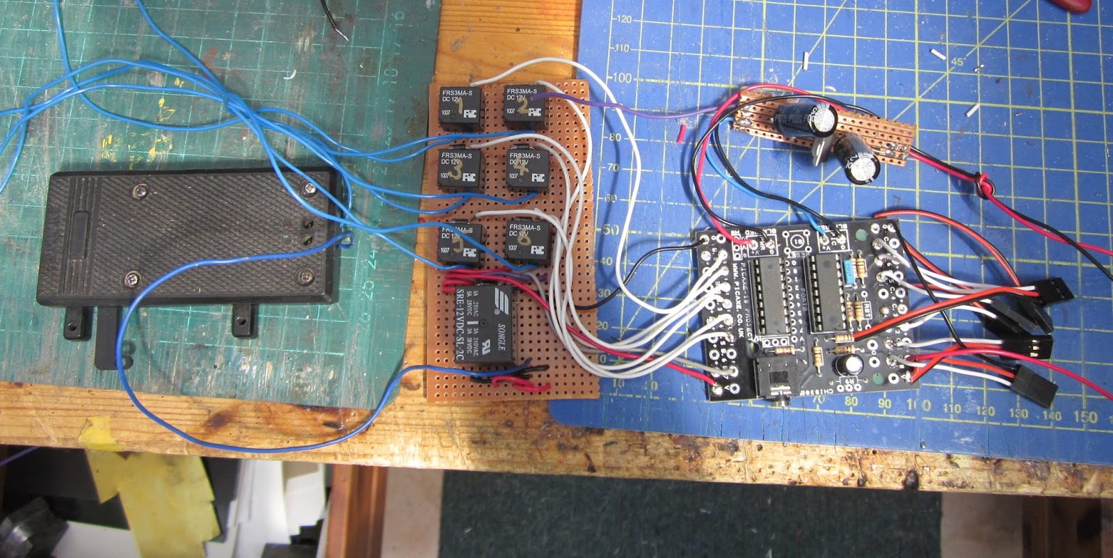 The Picaxe was then loaded with the full program and tested, before the  assembly was connected to the wiring for the point motors and placed in the  control ...