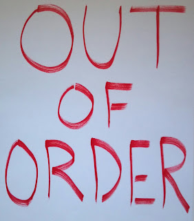 out of order sign in red ink