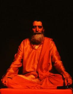 Image of and Indian yogi, meditating, saffron dress