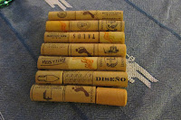 4 by 6 inch trivet made of 7 rows of plastic wine corks, 3 corks per row