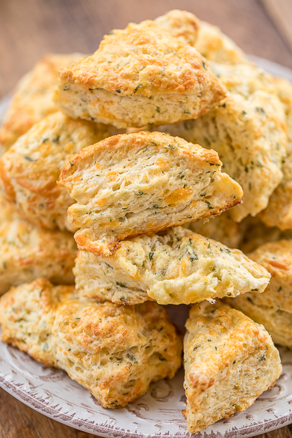 Mini Cheddar Scones - CRAZY good!!! They go with everything - soups, stews, casseroles, grilled meats. We make these yummy biscuits every week! Flour, baking soda, baking powder, salt, butter, cheese, and buttermilk. Surprisingly easy to make! We gobble these up!! #biscuits #cheddar #scones #breadrecipe Mini Cheddar Scones - CRAZY good!!! They go with everything - soups, stews, casseroles, grilled meats. We make these yummy biscuits every week! Flour, baking soda, baking powder, salt, butter, cheese, and buttermilk. Surprisingly easy to make! We gobble these up!! #biscuits #cheddar #scones #breadrecipe