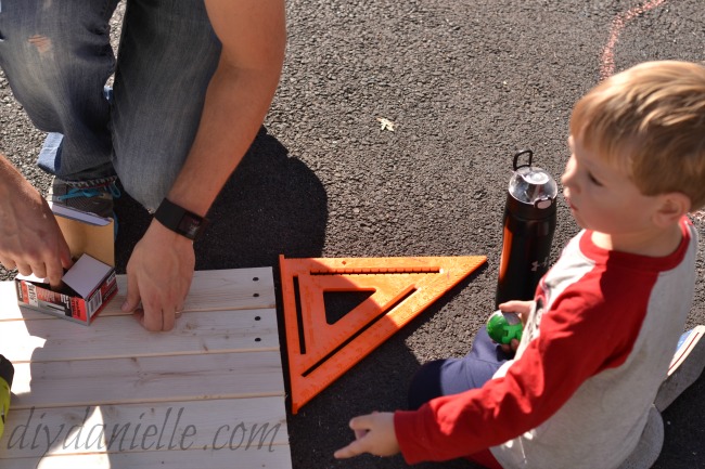 Screwing in all of our wood planks for our pet gate. Screwing in wood.