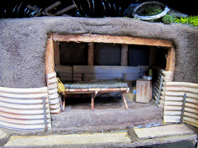 Miniature scene of an anderson shelter.