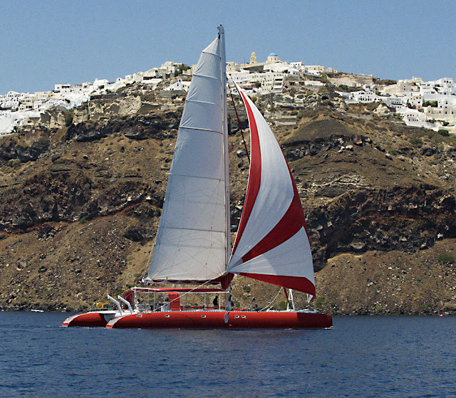 sunset oia sailing catamaran