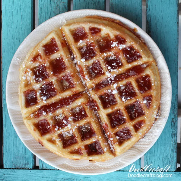 Make a sweet and savory Monte Cristo waffle with raspberry jam and powdered sugar