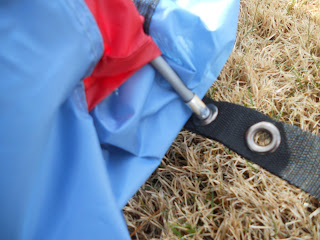 Assemble the rear arch pole (B) and insert into the first grommet on the web tabs on each side