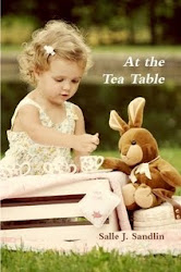 AT THE TEA TABLE