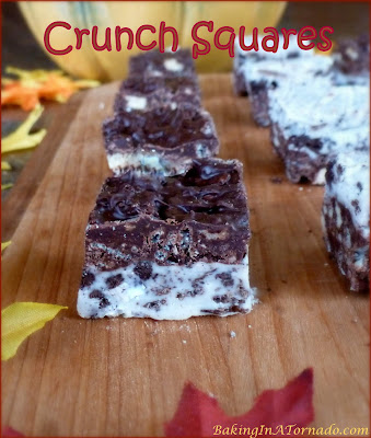 A sweet holiday treat, Crunch Squares are a no-bake treat that incorporate white and dark chocolate with rice cereal and sandwich cookies. | Recipe developed by www.BakingInATornado.com | #holiday #dessert 