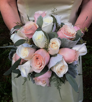 Bridal bouquet of creamy colored roses and soft dusty miller by Stein Your Florist Co. in Philadelphia, PA