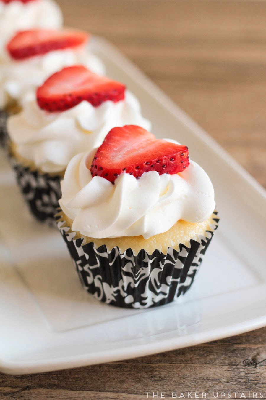 These tres leches cupcakes are so moist and flavorful, topped with lightly sweetened whipped cream and fresh strawberries. So, so good!