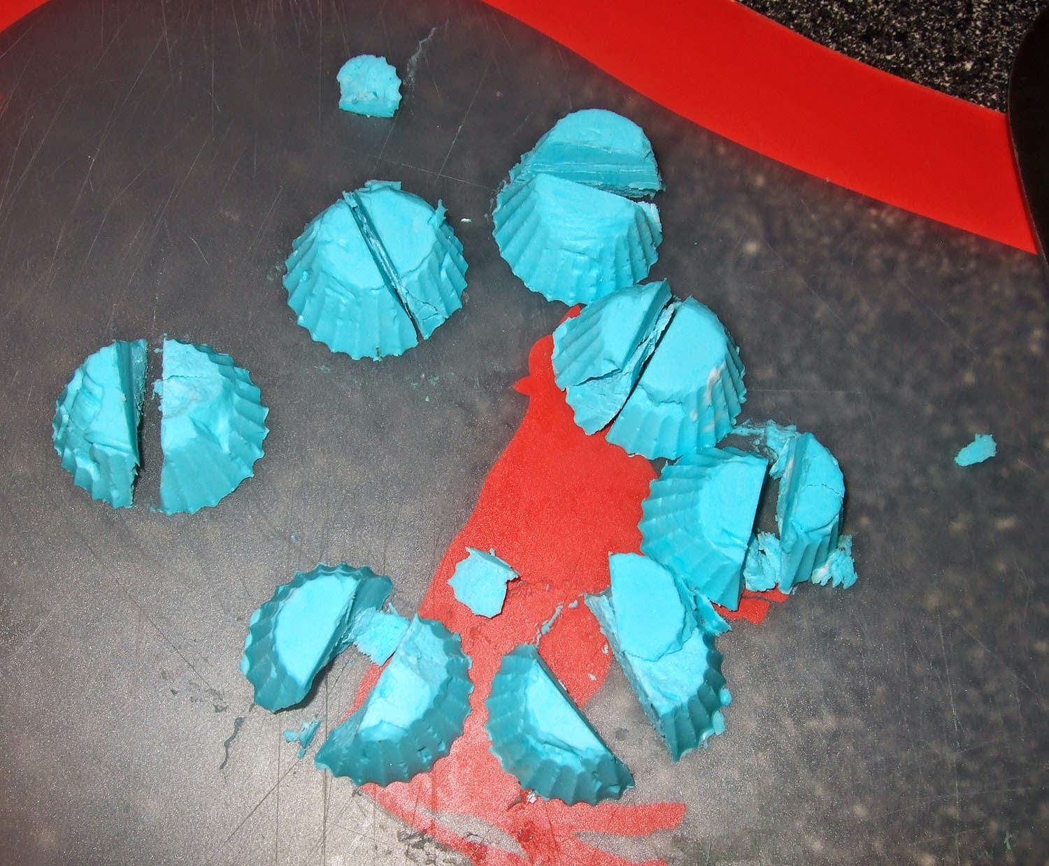 Cut up blue frosting bombs.
