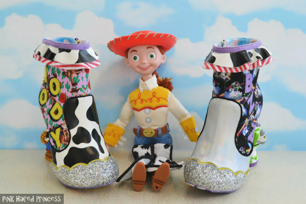Irregular Choice You Are A Toy! Disney Toy Story ankle boots cow print ankle boot next to Jessie large doll with silver ankle boot from Toy Story