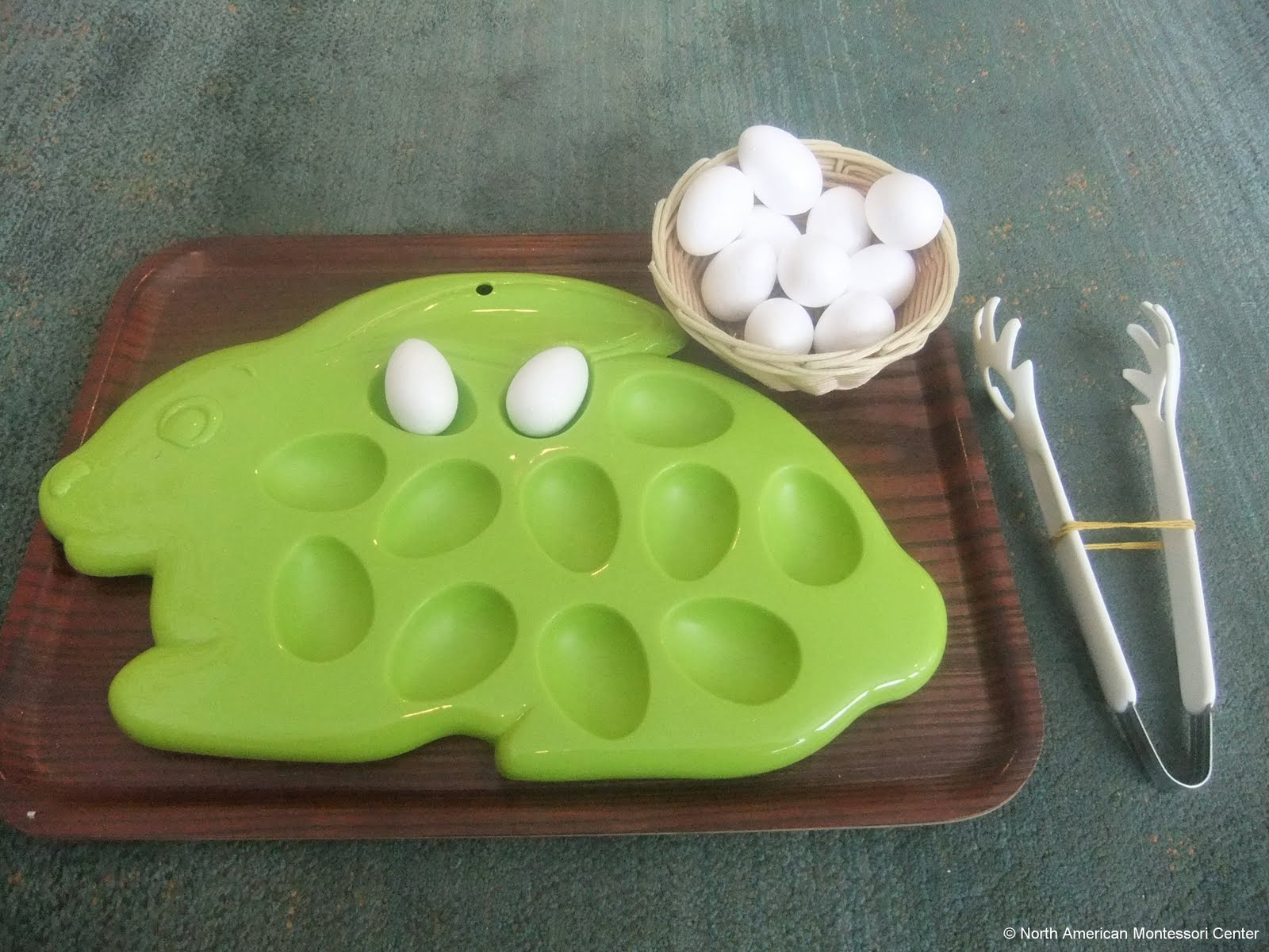 NAMC montessori preschool classroom Easter curriculum activities egg tongs tray