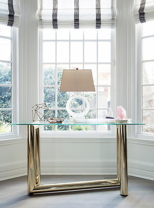 Decor inspiration: modern farmhouse living room with midcentury modern design. Karl Springer table with lamp and crystals in a modern vignette.