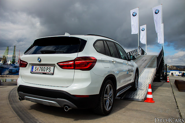 2016 BMW X1 rear and side view of the white model