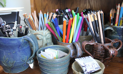 containers of art supplies