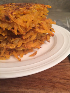 a stack of sweet potato pancakes on a plate 