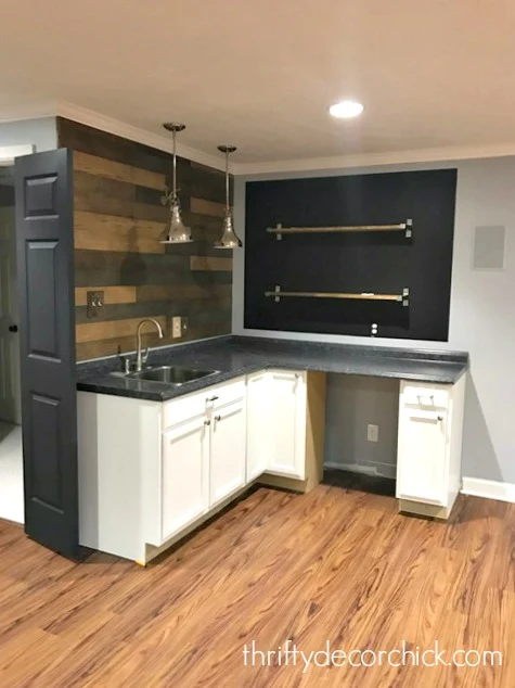basement kitchenette with shelves