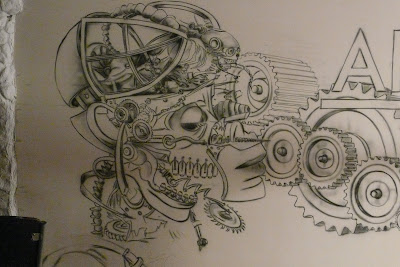 Biomechanika, mural Biomechanika steampunkowa, mural zdobi ścianę w klubie, aranżacja klubu