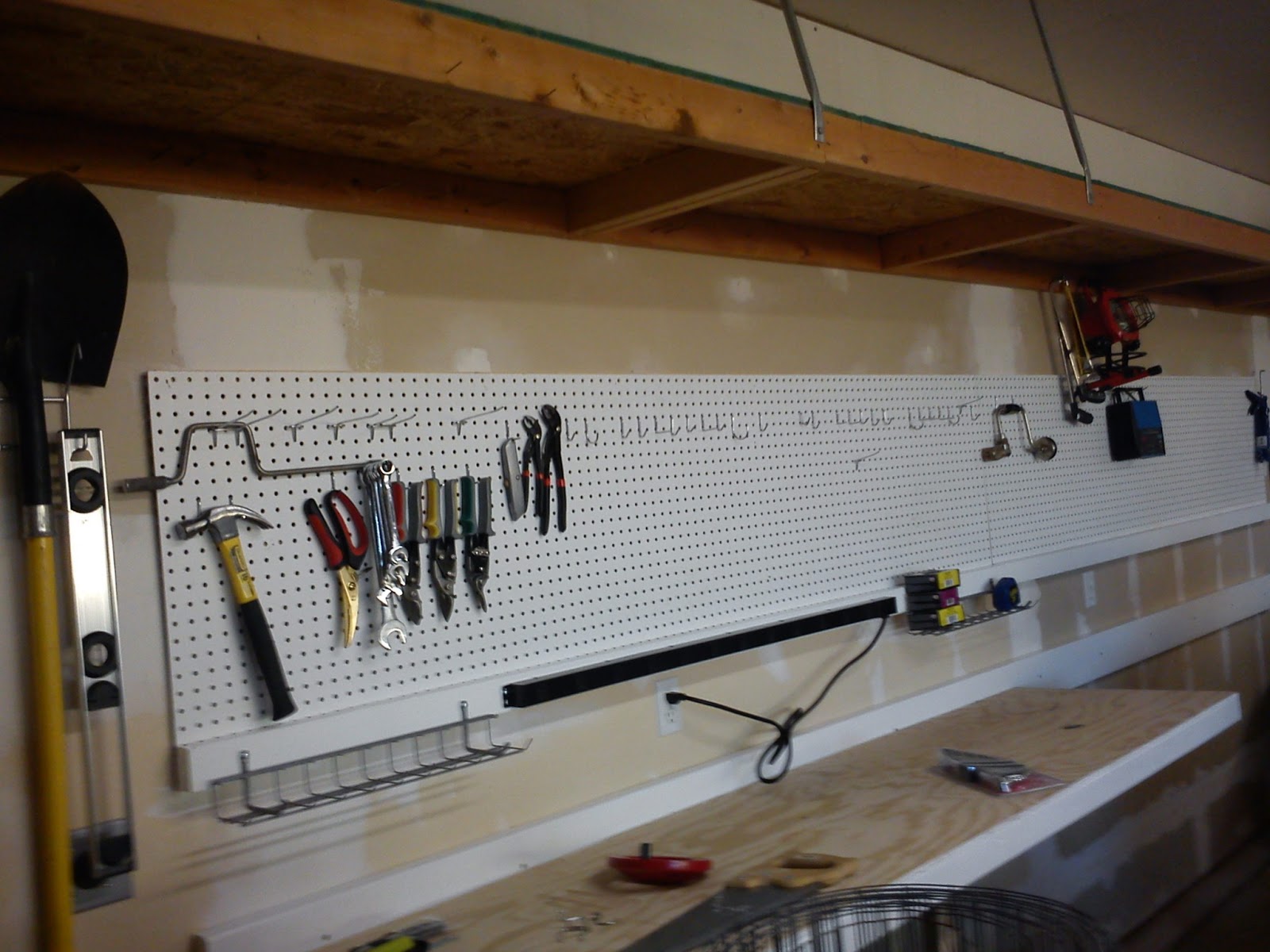 From a Distance 16 foot wall mounted workbench with pegboard