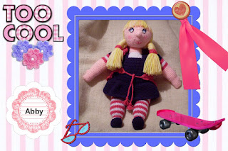 a ton of cuteness, huge blue eyes, blonde fishtail yarn braids amigurumi crocheted doll pattern