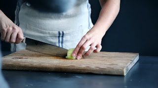 chef cutting an apple