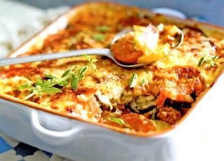 Lamb Moussaka: Classic Greek dish of lamb in a tomato sauce topped with vegetables and then a white cheese sauce that's oven baked in a baking dish