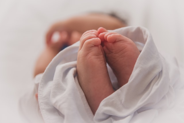 Image: Baby Covered in a White Blanket, Photo by Luma Pimentel on Unsplash