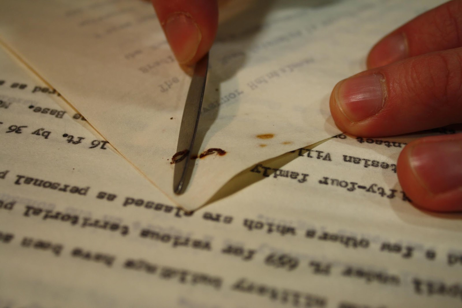 Turn the stapled documents over to the front and using the archival