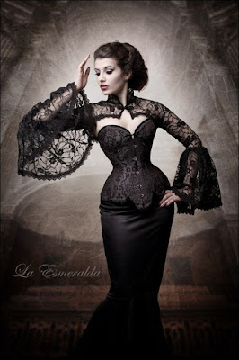 An example of longline corsets being used in women's steampunk fashion. This woman is wearing her longline corset with a long sleeve lace shrug and black fishtail skirt.