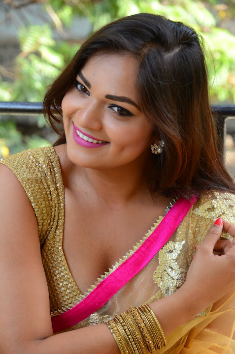 Ashwini Cleavage in Yellow Saree