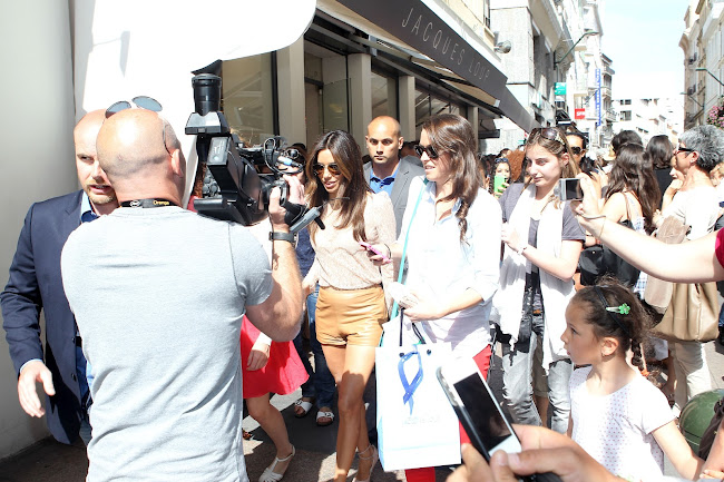 Eva Longoria joined by a crowd as she went for a walk at Cannes during the 65th Film Festival