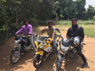John Mark, Naguraj, and Vivek with their motobikes