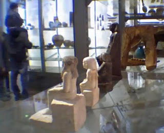 A pharaonic statue circling without being touched at the Manchester Museum A pharaonic statue circling without being touched at the Manchester Museum