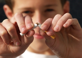 Breaking a cigarette. Breaking a cigarette.