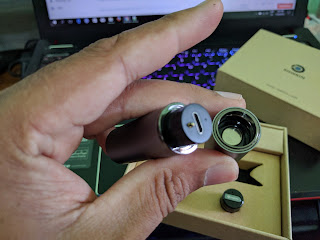 The charging case opened, showing the charge port The charging case opened, showing the charge port