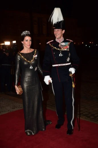 Crown Prince Frederik, Crown Princess Mary, Prince Jaochim and Princess Marie attend New Year's Banquet at Amalienborg Palace. Crown Princess Mary diamon tiara, Princess Marie diamond tiara, diamond earrings, Princess Mary wore diamond earrings wore satin govn and cape