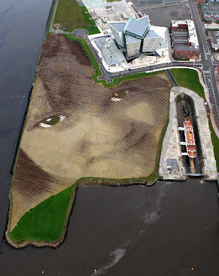 An aerial picture shows Britain and Ireland’s largest land art entitled Wish at Belfast’s Titanic Quarter in Northern Ireland. Spanning 11 acres, the artwork, by Cuban-American artist Jorge Rodriguez-Gerada, is made up from 30,000 pegs, 2,000 tonnes of soil and 2,000 tonnes of sand. The land art shows the face of an anonymous six-year-old Belfast girl. Rodriguez-Gerada said the land art, which was put together with the help of an army of local volunteer, is the largest he has ever produced.