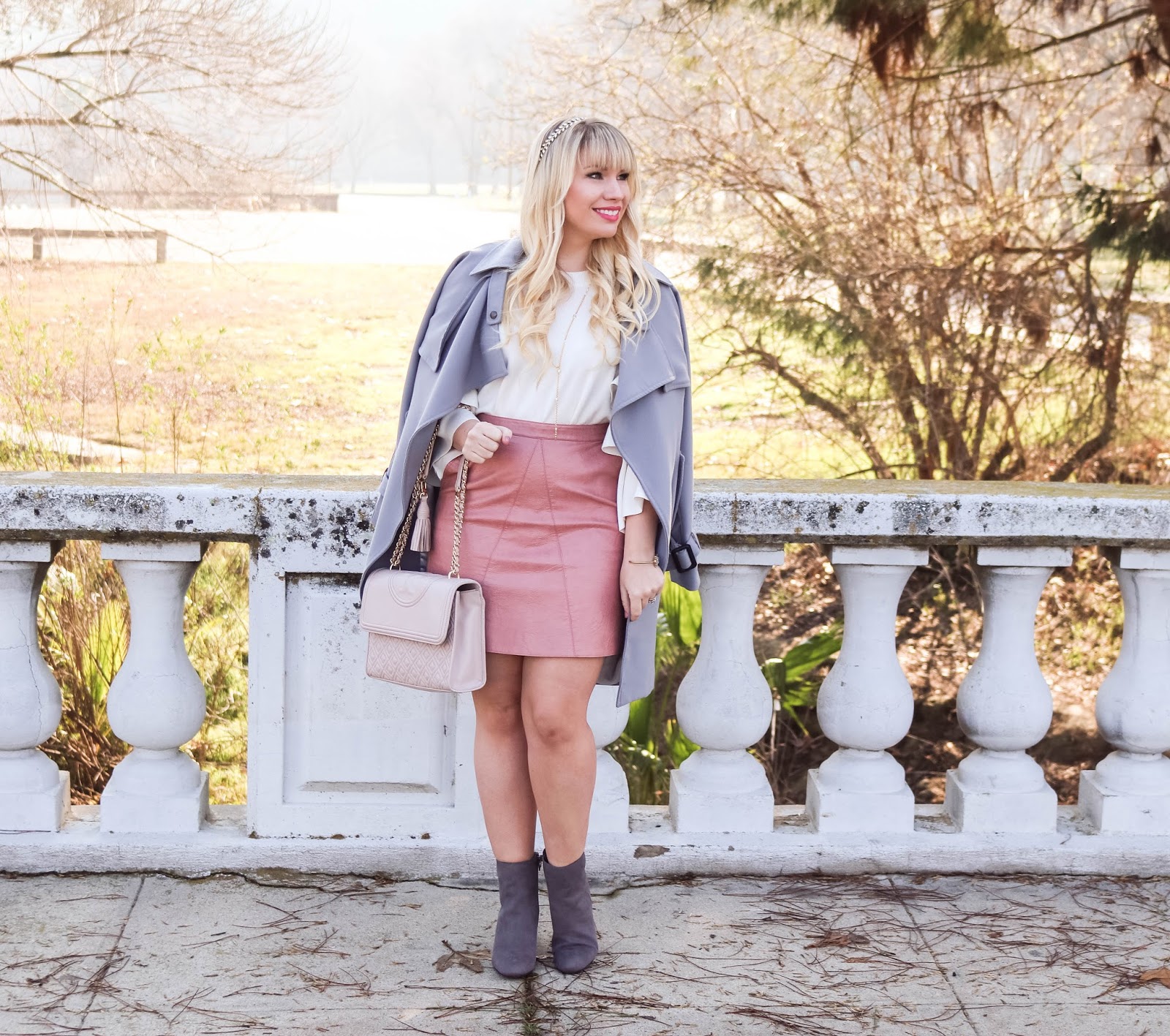 Feminine fashion blogger Lizzie in Lace shares a Pink Faux Leather Skirt Outfit