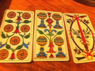 Three carot cards on a table