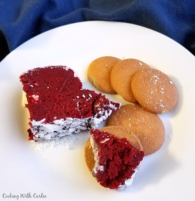 small amount of red velvet cheese ball served on plate with vanilla wafers