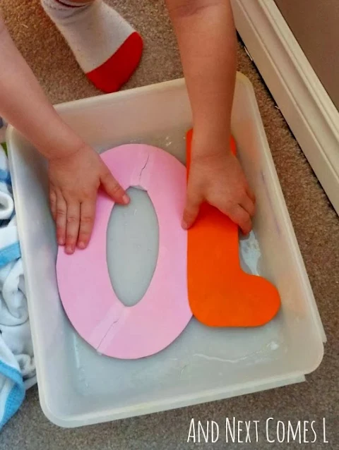 Playing with homemade craft foam numbers in water
