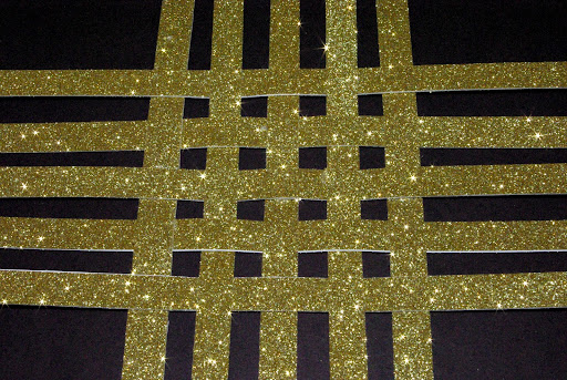 layering gold strips in a cross hatching pattern 