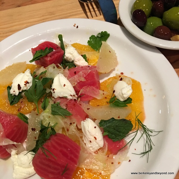 colorful citrus-beet salad and olives at Benchmark Oakland in California colorful citrus-beet salad and olives at Benchmark Oakland in California