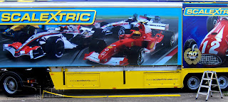 Photograph of Hornby lorry with full colour printed graphics of race cars.