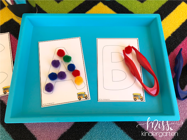 Using tweezers for fine motor practice