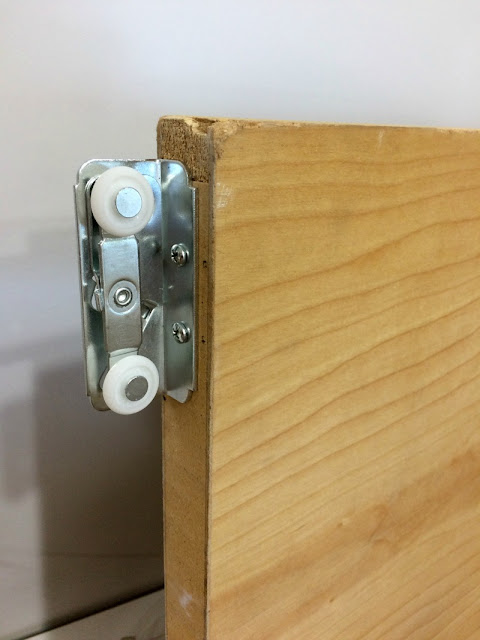 DIY your own barn style door using a slab and pocket door hardware.