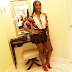 Tiwa Savage cexy in mini skirt and unbuttoned shirt