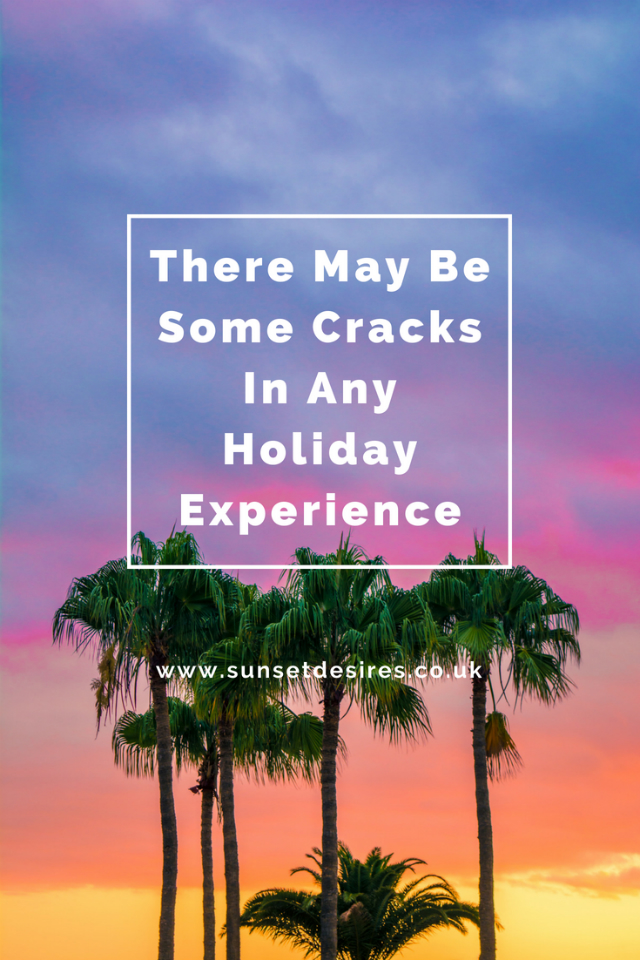 There May Be Some Cracks In Any Holiday Experience Banner saying There May Be Some Cracks In Any Holiday Experience with sunset background