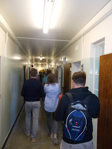Tourists inside the main prison cells of "Robben Island".